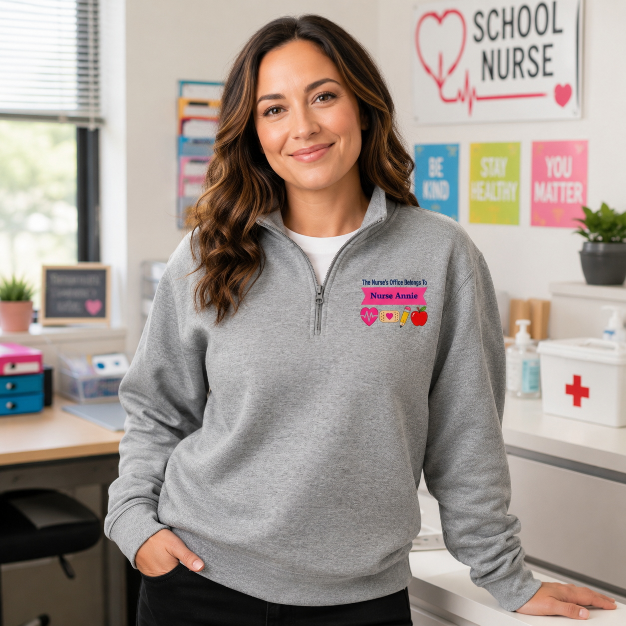 School nurse standing inside her office wearing the personalized pullover.
