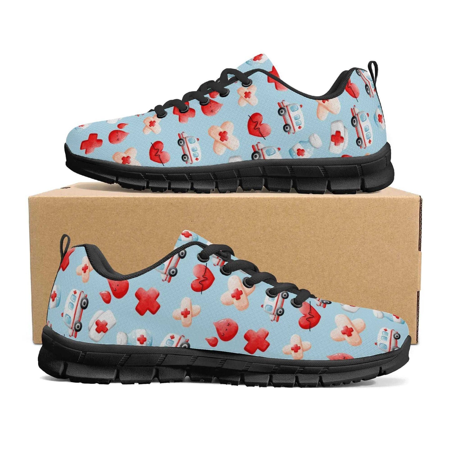 A pair of Ambulance Sneakers: Fun shoes for nurses, featuring a light blue background with a pattern of red crosses, bandaged hearts, and ambulance images. The sneakers have black laces and soles designed for comfort and are displayed on a plain brown shoe box.