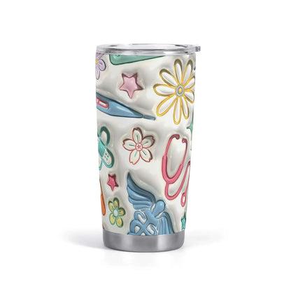 The 20oz 3D Inflated Tumbler, perfect for hot and cold drinks on-the-go, features a white stainless steel base adorned with colorful medical-themed illustrations including a stethoscope, syringe, band-aid, assorted flowers, and stars. This double-walled tumbler includes a splash-proof clear plastic lid.