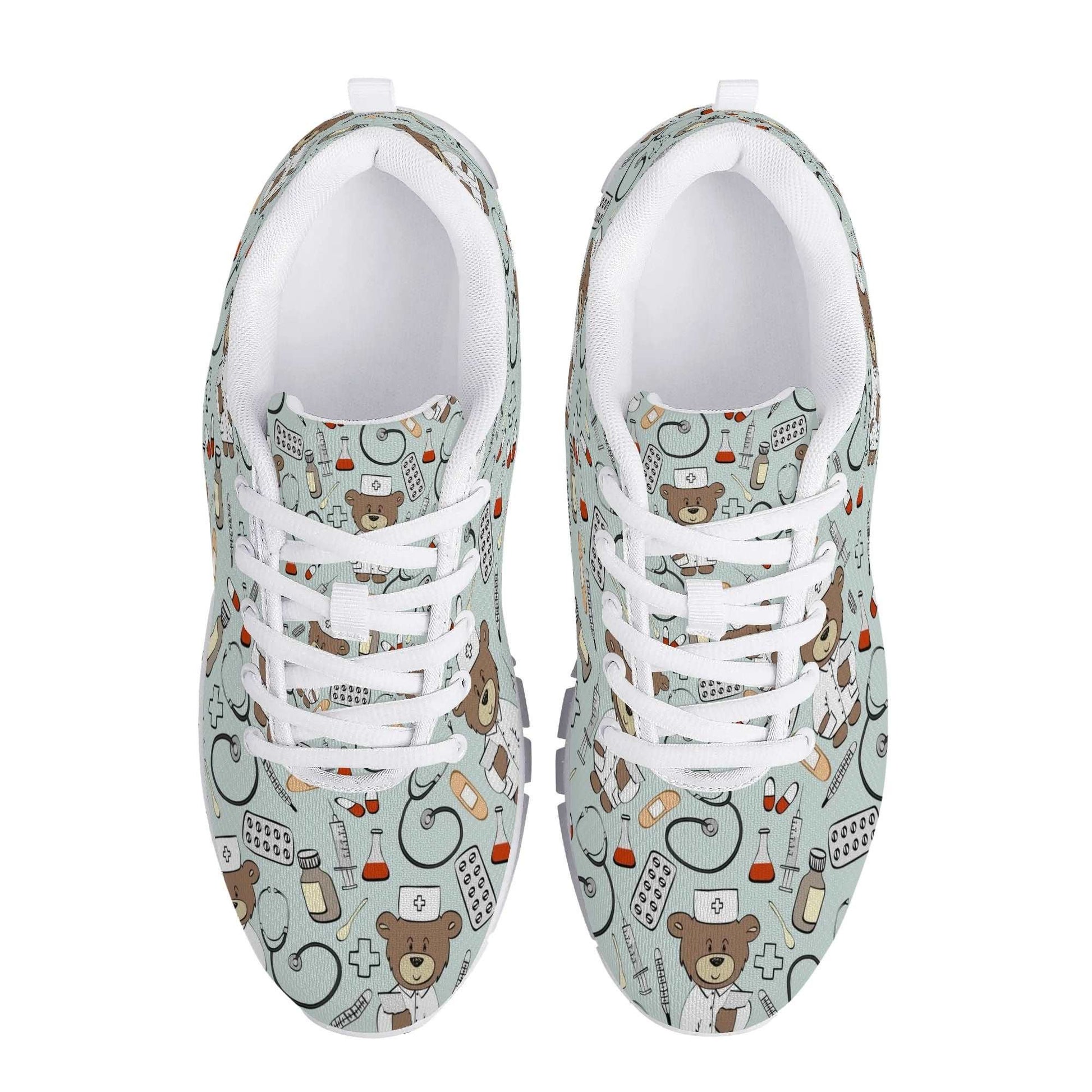 A pair of Care Bear Sneakers in light blue, viewed from above, showcase a whimsical pattern featuring teddy bears wearing nurse caps, medicine bottles, syringes, pills, bandages, and red crosses—making them the perfect comfortable nursing shoes with a playful healthcare or medical theme.