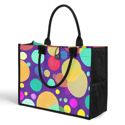 The Nurse Essentials Carry Bag: Reinforced Handles & Button Closure for Secure Storage features a vibrant polka dot pattern with large and small circles in various shades of yellow, orange, green, blue, and purple on a dark purple background. It boasts reinforced black handles, a front button closure, spacious design, and black mesh side pockets.