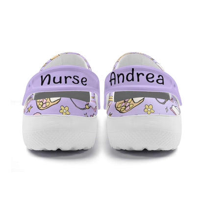 Personalized purple nurse clogs with names 'Nurse' and 'Andrea' on the back, perfect for comfort and style.