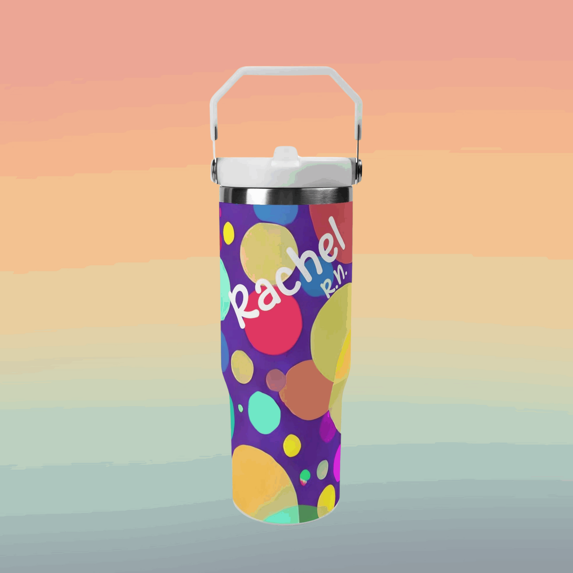 The 30oz Nurse Tumbler with Stylish Circle Design is showcased against a gradient background, adorned with colorful, overlapping circles. The tumbler features "Rachel" in large, white script and "R.N." in smaller white text below. A white handle attached to the lid enhances portability, making it ideal for busy nurses.