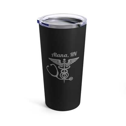 The Personalized 20oz Tumbler for Medical Professionals, in black, is an ideal gift set against a white background. The tumbler features the name "Alana, RN" etched in silver alongside a medical caduceus symbol and a stethoscope design. It includes a clear lid for personalized hydration.